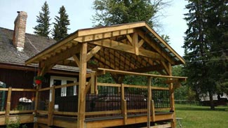 Rubus Woodworks Craftsman-style roof system  built over hot tub and bbq area