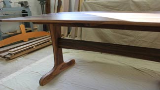 Rubus Woodworks Walnut trestle table with beadboard ends