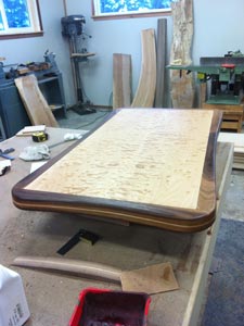 Rubus Woodworks Quilted maple table with walnut accents