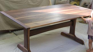 Rubus Woodworks Walnut trestle table with beadboard ends