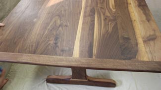 Rubus Woodworks Walnut trestle table with beadboard ends