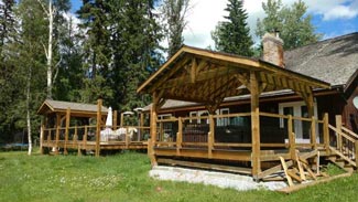 Rubus Woodworks Craftsman-style roof system  built over hot tub and bbq area