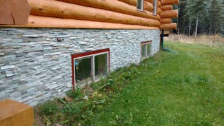 Rubus Woodworks Stone siding on log house